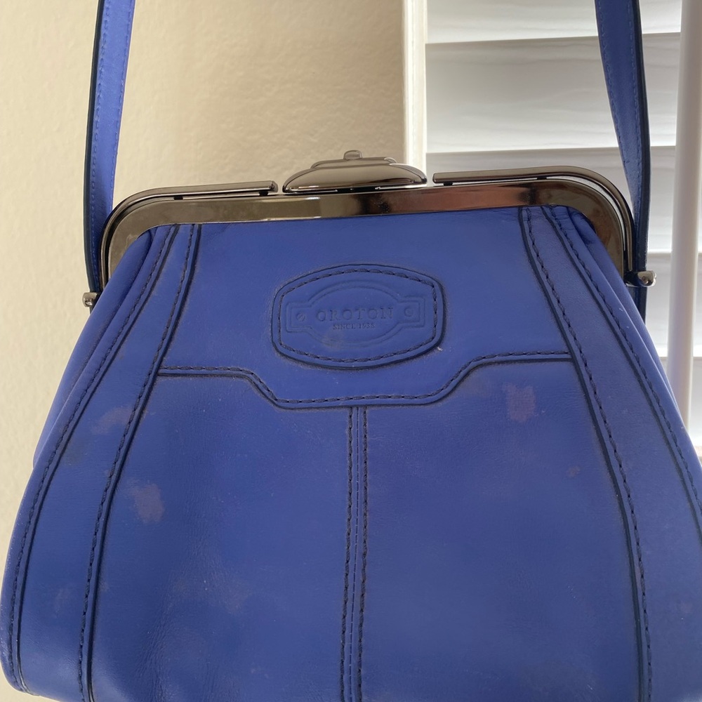 Oroton blue cross body vintage style purse. 100% leather